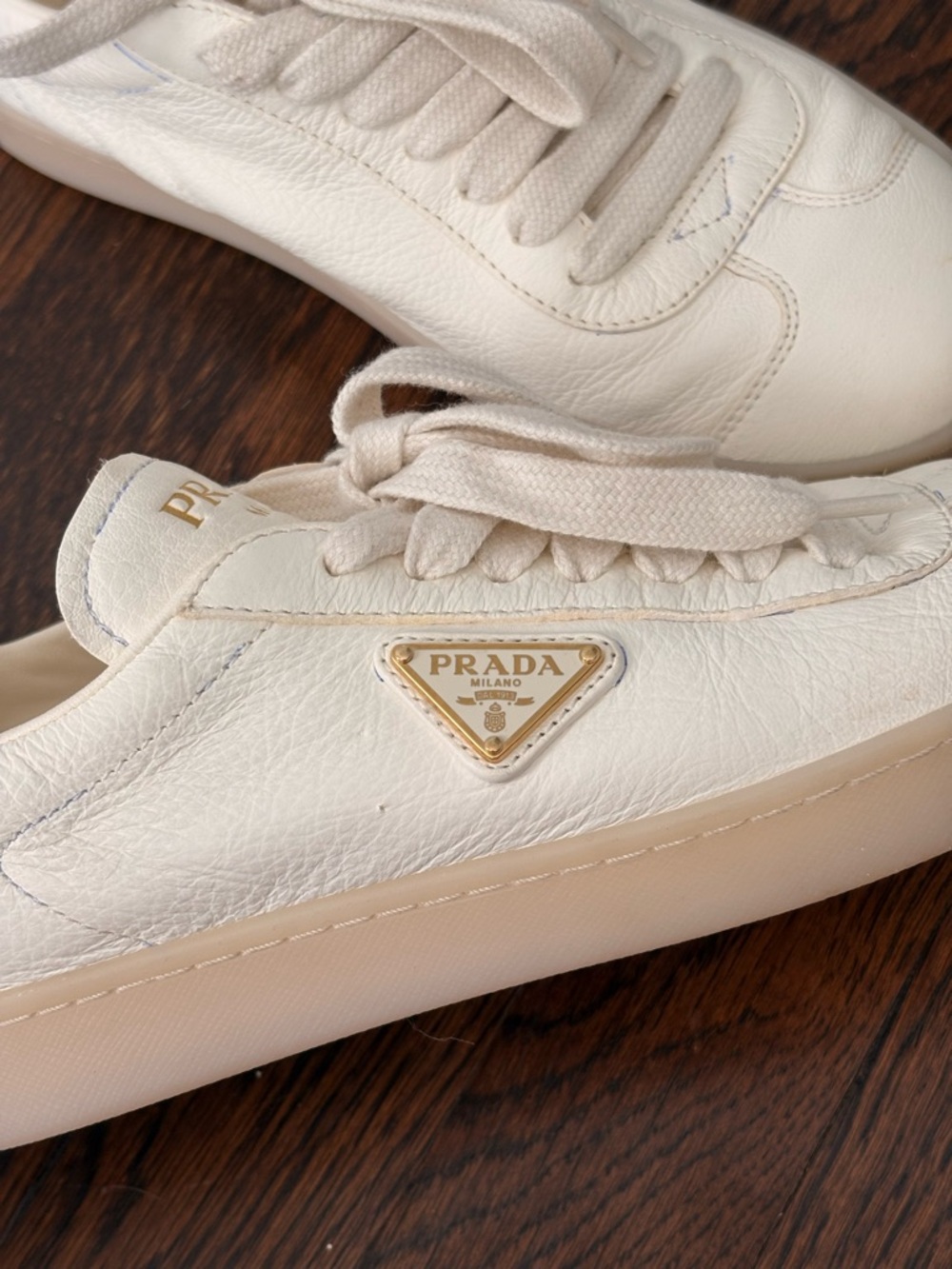 Prada Cream Leather Low-Top Sneakers with Gold Triangle Logo